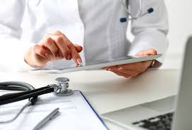 doctor using tablet at desk